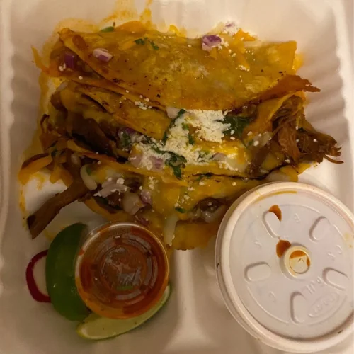 Birria Tacos - Slow-braised beef birria served in crispy, cheese-dipped tortillas with consommé for dipping — our most popular dish.