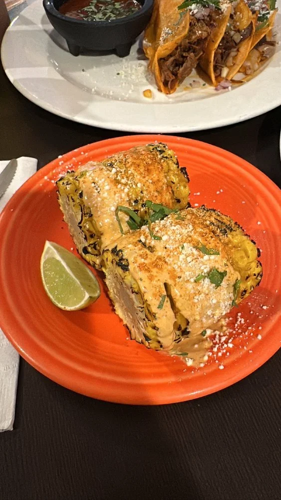 Crazy Elote - Mexican street corn loaded with mayo, cotija cheese, chili powder, and lime.