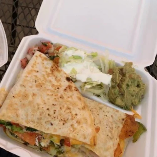 Veggie Quesadilla - Grilled flour tortilla filled with fresh vegetables and melted cheese — perfect for vegetarians.